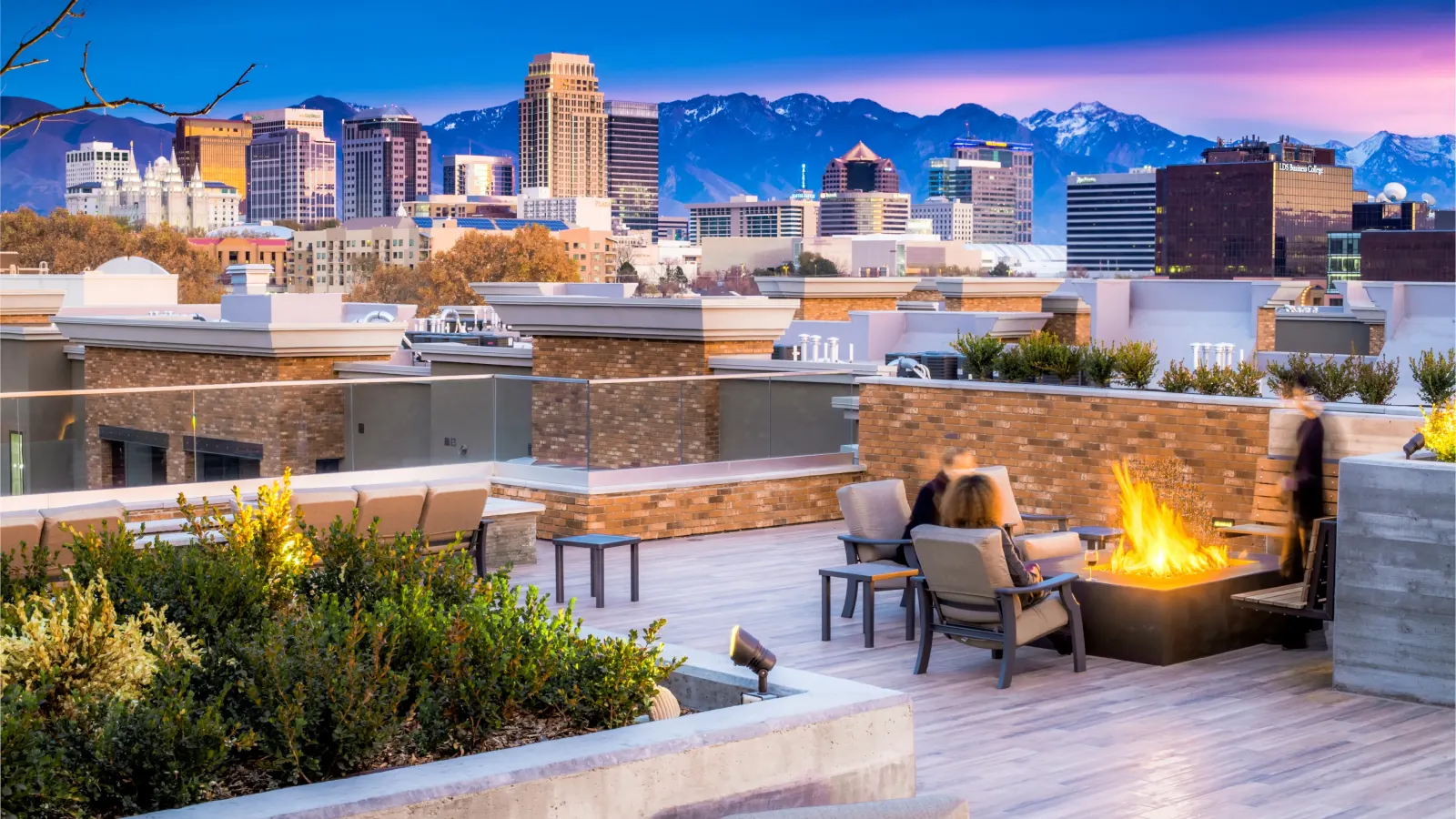 STAND-IN BRANDON TO VET — fire lounge with city view at golden hour, second cinematic moment