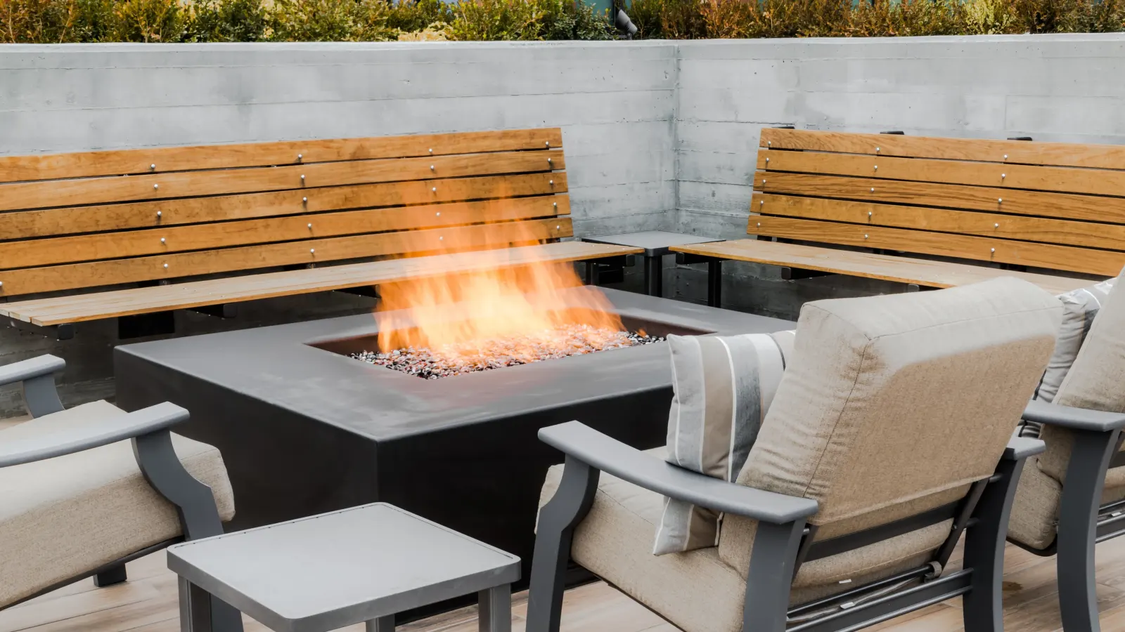 Fire lounges by day, skyline beyond