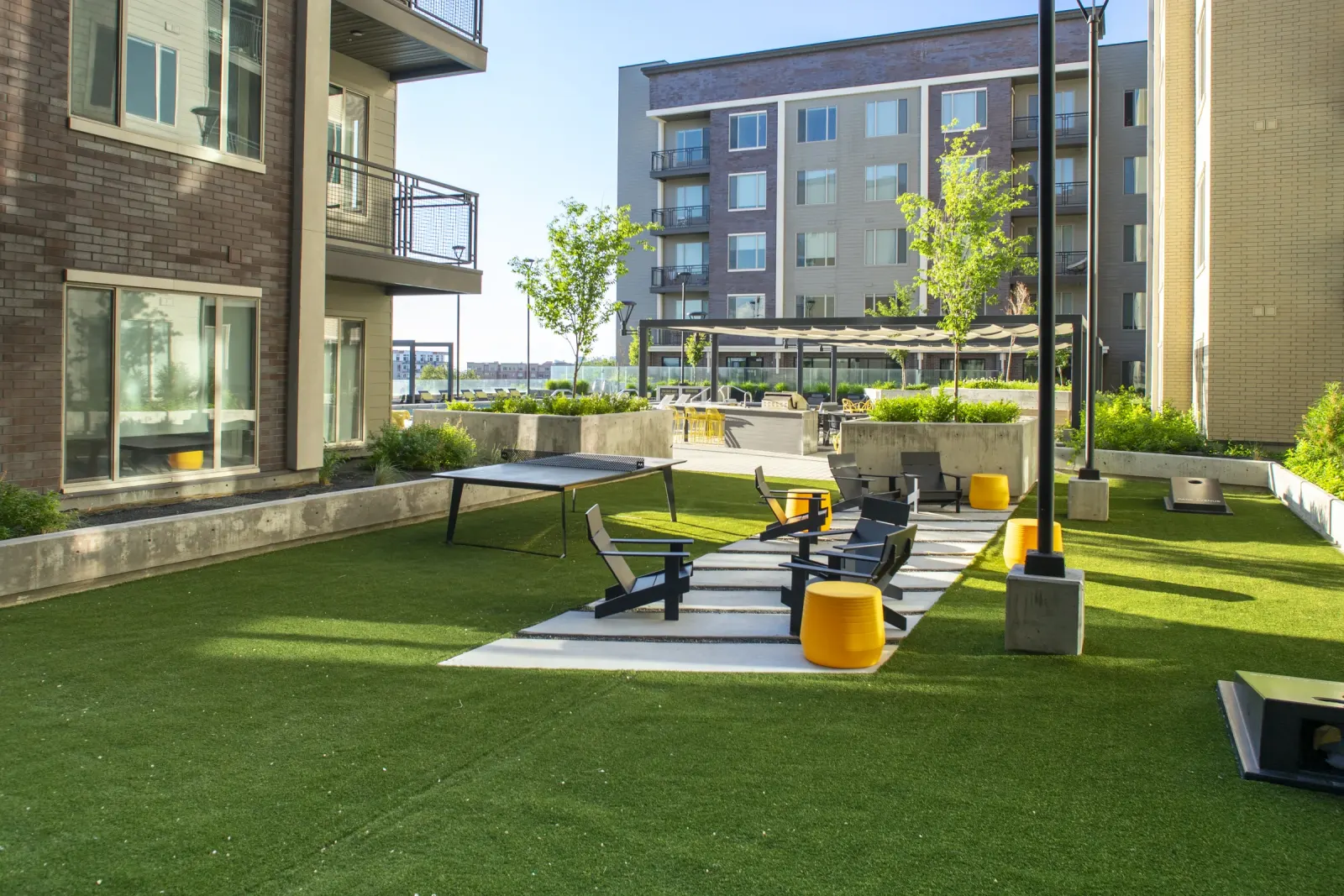 Park Avenue courtyard lawn and ping pong amenity zone