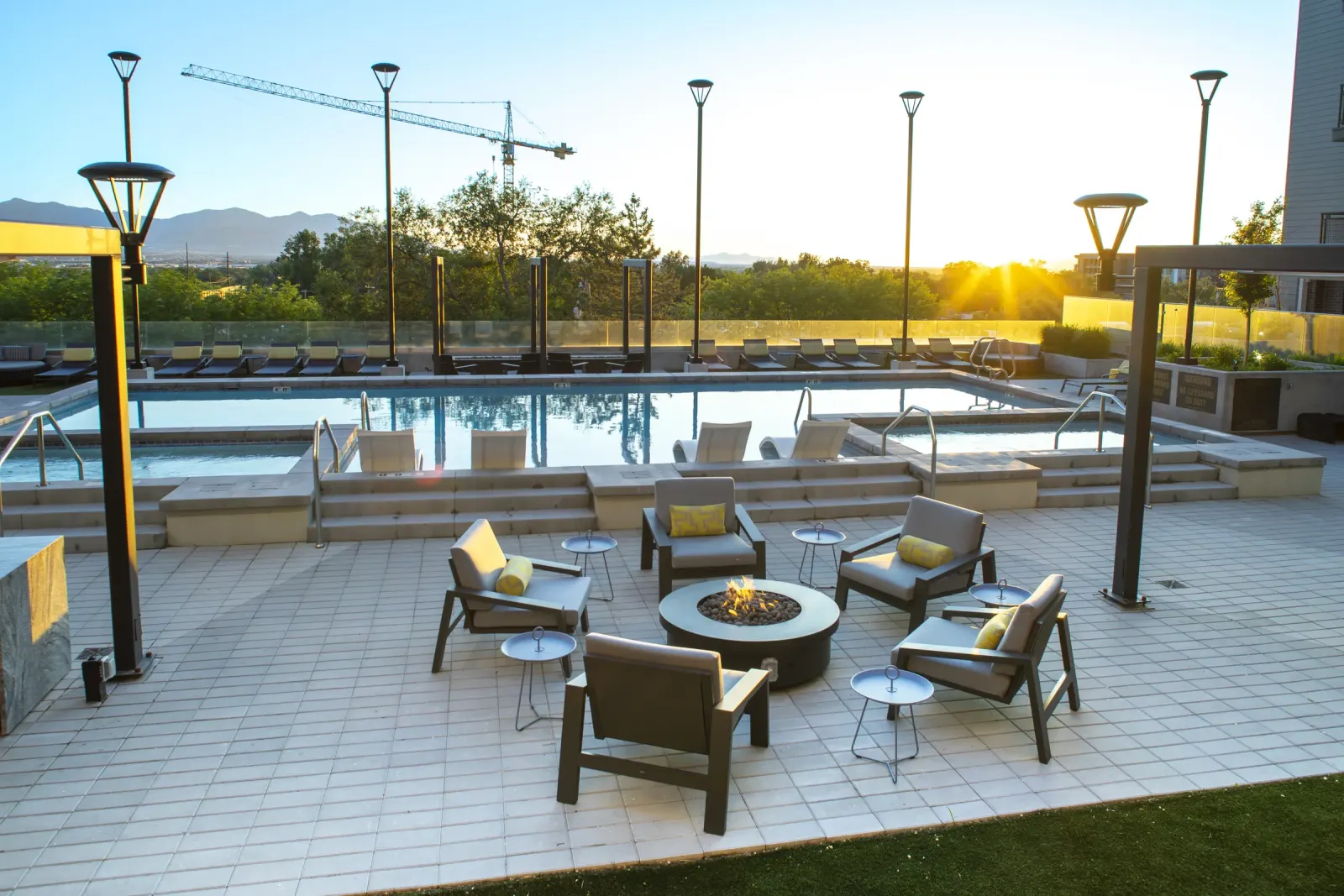 Park Avenue rooftop pool and fire pit lounge at sunset