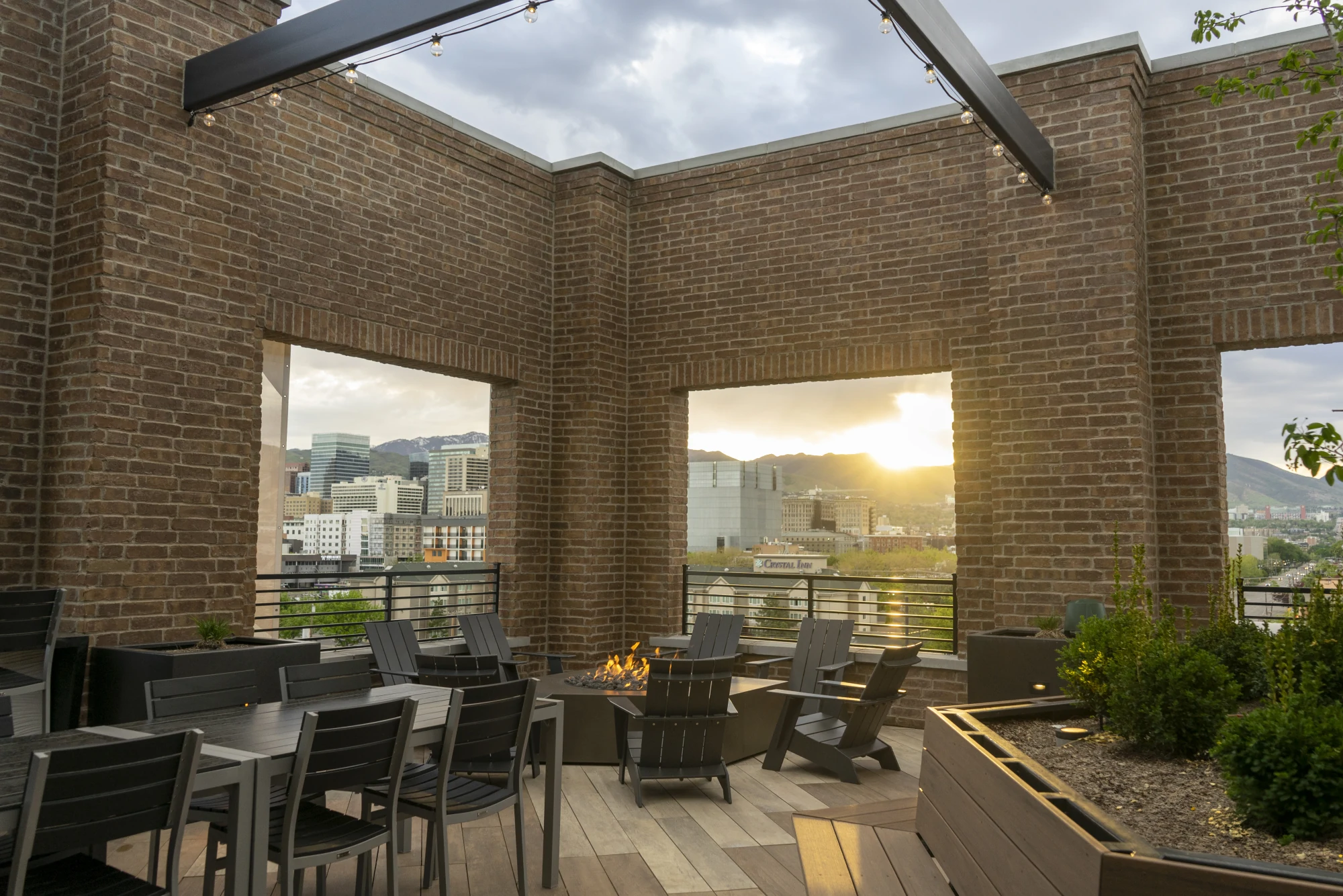 The rooftop firepit decks · the signature amenity