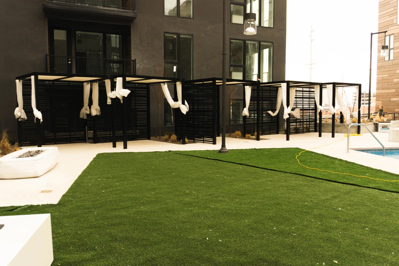 Cabanas opening onto the turf courtyard