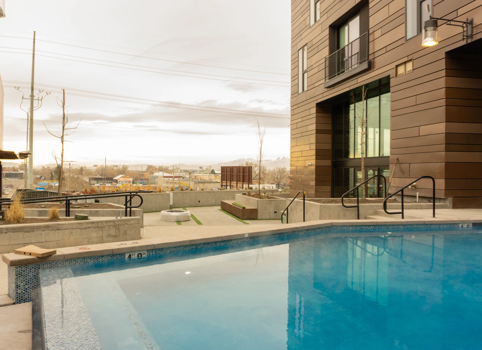 02 · The Podium Pools, Two courtyards, built for every season.