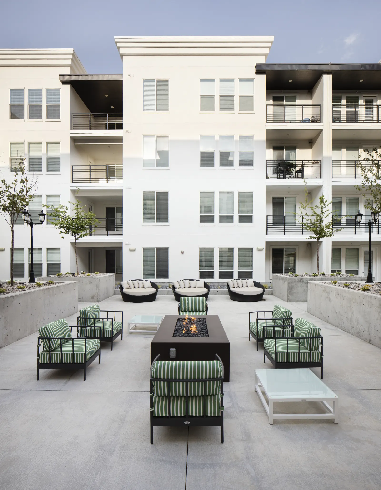 Podium courtyard fire feature, symmetrical seating arrangement