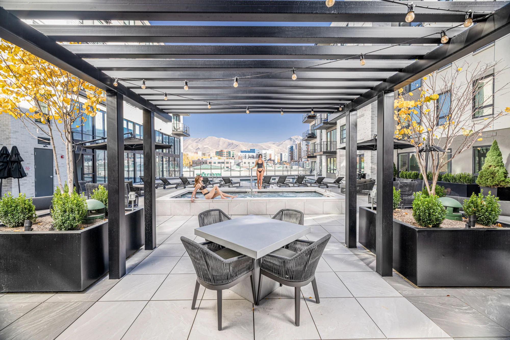 The pool deck · pool, spa, and the Wasatch beyond