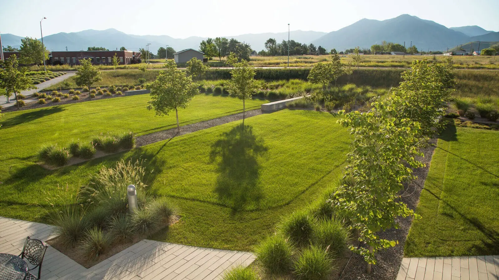 Tooele Tech campus event lawn and native meadow with mountains beyond